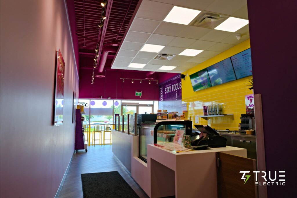 Completed modern interior ordering counter of a Booster Juice franchise renovation in Surrey