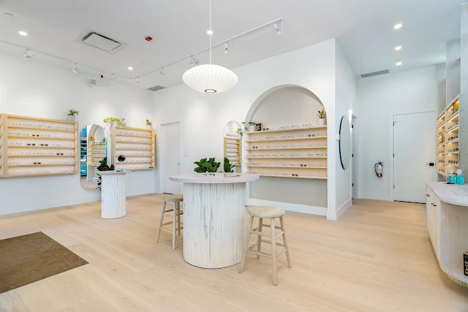 Sleek modern glass commercial storefront and custom entrance built for a retail boutique in Brentwood Plaza.