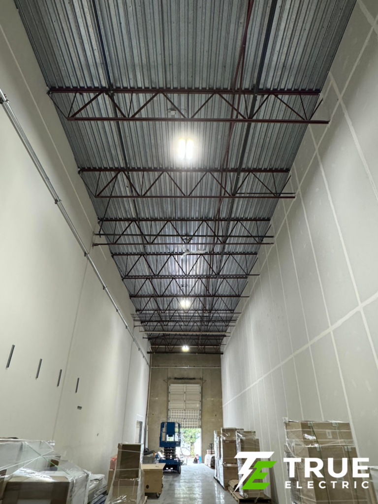 Bright interior of a South Surrey commercial warehouse following an energy-efficient LED lighting retrofit engineered to qualify for BC Hydro business incentives.